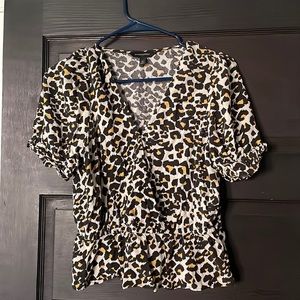 Animal Print cute top. Can be dressed up or down.